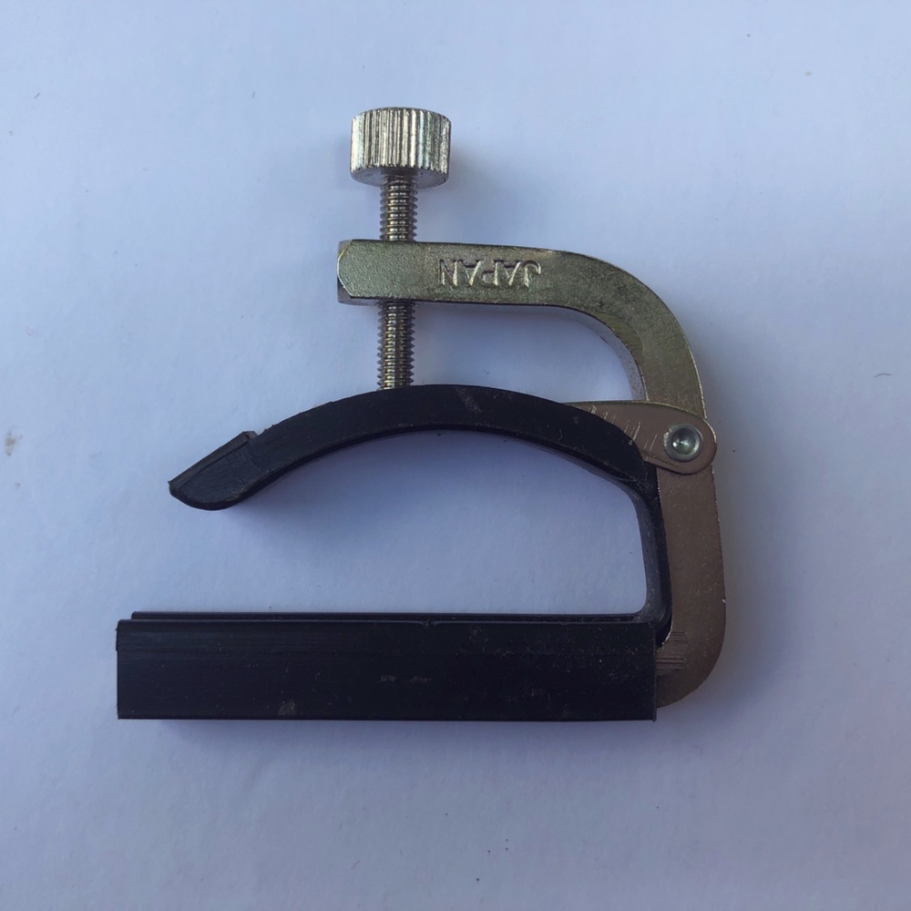 Capo for guitar.  Tuning clip.